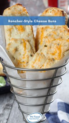 some type of cheesy bread in a metal basket