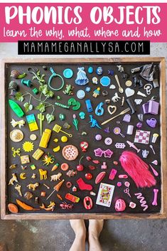 a child's feet are shown in front of a blackboard with toys on it