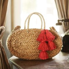 Adorable oval woven beach straw bag made by artisans in Bali in natural round shape. Sourced directly from artisans and hand-finished in our studio in La Jolla, California. Bag Details : • Dimension : around W 13 x H 8 inches • Depth : around 3 inches • Material : woven dried grass from Java• Lined Fuschia Pink Color, Woven Beach Bags, La Jolla California, Straw Beach Bag, Fuschia Pink, Straw Tote Bag, Bag Details, Pink Tassel, Woven Tote Bag