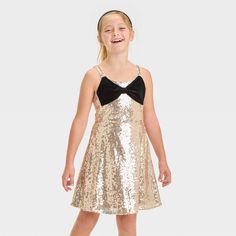 Upgrade your kid's wardrobe for parties and more with this Sleeveless Sequin Skater Velvet Bow Dress from Cat & Jack™. Made of polyester velour fabric, this sleeveless dress features a velvet bow at the front for an elevated look. Featuring a round neckline with a square back, this knee-length dress also has a back half-length zipper for easy on and off. Cat & Jack™: Designed for all children so you can trust it's made for yours. Velour Dress, Velour Fabric, Kids Wardrobe, Bow Dress, Velvet Bow, Kids Outfits Girls, Polyester Dress, Girls Long Sleeve, Dress Romper