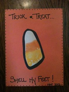 a card with the words trick or treat, smell my feet written in black on an orange background