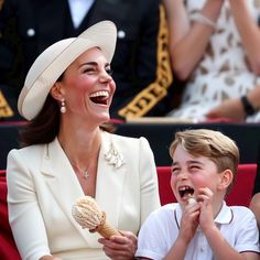 a woman and boy sitting next to each other eating ice cream