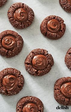 cookies with chocolate frosting on a baking sheet