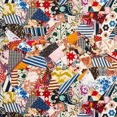 many different colored pieces of fabric with flowers and stripes on the top, all together