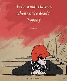 a man with a red hat sitting at a table in front of a sign that says, who wants flowers when you're dead nobody?