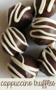 chocolate covered candies with white frosting in a circle on a plate that says cappuccino truffles