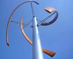 an artistic sculpture is shown against the blue sky