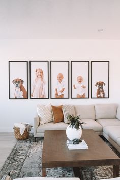 a living room filled with furniture and pictures on the wall above it's coffee table