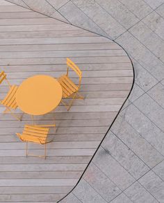 an overhead view of a table and four chairs