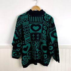 Vintage 1980s patterned acrylic sweater in black and jade by Stefano International. Block design with hearts and more. Drop shoulders. Designed to be oversized. Made in Russia. Material / 100% Acrylic Care / Machine wash cold, tumble dry low Suggested modern size / L - XL for a tighter fit Size on tag / L Measurements (taken flat then doubled) Armpit to armpit 48" Waist 42" Sleeve, armpit to hem 16" Shoulder to shoulder 15" Shoulder to hem 25.5" CONDITION Very good. Minor pilling. This is a vint Green Oversized Retro Sweater, 90s Cotton Sweater With Graphic Print, 90s Green Winter Sweater, Vintage Green Oversized Sweater, Chunky 80s Sweater, Cheap Streetwear, Vintage Multicolor Acrylic Sweater, Vintage Multicolor Graphic Print Sweater, 80s Print Sweater