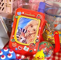 there are many toys on the table and in front of it is a photo frame