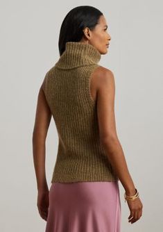 Perfect for layering, this sleeveless sweater is defined by a turtleneck design, a slim silhouette, and a rib-knit construction. This Lauren Ralph Lauren style is realized in a wool-blend fabric with a hint of shimmer for a soft hand feel. Slim fit Intended to hit at the hip Size medium has a 21.5" body length Body length is taken from the high point of the shoulder Turtleneck Pull-on styling Sleeveless silhouette with ribbed armbands Ribbed hem Model is 5'10" (178 cm) and wears a size small Thi Sleeveless Turtleneck Sweater, Lurex Sweater, Ralph Lauren Womens Clothing, Sleeveless Turtleneck Sweaters, Sleeveless Jumper, Sweater Tops, Ladies Turtleneck Sweaters, Sleeveless Turtleneck, Lauren By Ralph Lauren