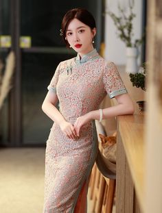 Step into timeless elegance with this exquisite lace Cheongsam, perfect for any special occasion. This dress features a delicate floral lace overlay, creating an ethereal and sophisticated silhouette. The short sleeves and high collar add a touch of traditional charm, while the soft pastel hue enhances its graceful appeal. It an excellent choice for events like weddings, Chinese New Year celebrations, formal events, cultural occasions or elegant evening gatherings. Size Guide: Size Bust(cm) Wais Elegant Short Sleeve Dress With Delicate Lace, Elegant Lace Dress With Short Sleeves, Pink Short Sleeve Lace Dress With Patchwork, Pink Lace Dress With Short Sleeves And Lace Patchwork, Elegant Short Sleeve Lace Dress With Delicate Lace, Elegant Short Sleeve Lace Dress With Delicate Details, Pink Short Sleeve Lace Dress For Formal, Pink Short Sleeve Lace Dress For Formal Occasions, Pink Short Sleeve Lace Dress For Formal Events