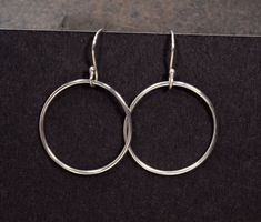 "SALE Beautiful 1\" circle earrings in solid Sterling Silver, hand formed, soldered, and finished from .925 Sterling Silver wire, dangle gracefully from my handmade, artisan style .925 Sterling Silver ear wires at a total length of just slightly more than 1 1/2 inches from the top of the ear wire to the bottom of the dangling circle. Made from USA 100% recycled sterling silver. These will quickly gain a place among your go-to-jewelry favorites, as they easily go from fun to professional attire. Hypoallergenic Open Circle Hoop Earrings For Gift, Adjustable Round Hoop Earrings As Gift, Cadmium-free Round Earrings For Everyday, Minimalist Small Hoop Earrings Cadmium-free, Adjustable Sterling Silver Hoop Earrings, Adjustable Round Sterling Silver Hoop Earrings, Gift Hoop Earrings With Open Circle, Nickel-free Hoop Earrings Gift, Sterling Silver Circle Hoop Earrings With Ear Wire