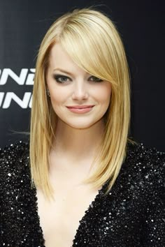 Sleek Locks: This starts with your blowdryer. To reduce static, bust frizz, and boost shine, be sure to choose one with ceramic technology. For the look seen here, part your hair to the side and use a paddle brush for just the right amount of volume and body. Emma Stone Blonde, Emma Stone Hair, Sarah Drew, Hair Evolution, Straight Blonde Hair, Long Bangs, Anne Hathaway, Emma Stone