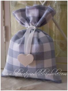 a blue and white checkered bag with a heart on it