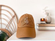 Brown Embroidered Curved Brim Baseball Cap, Brown Embroidered Baseball Cap With Curved Brim, Embroidered Logo Cap As Gift, Curved Brim Hat With Embroidered Logo As Gift, Curved Brim Hat With Embroidered Logo For Gift, Brown Curved Brim Snapback Hat Gift, Adjustable Dad Hat With Embroidered Logo As Gift, Brown Curved Bill Hat For Gift, Adjustable Curved Brim Dad Hat As Gift