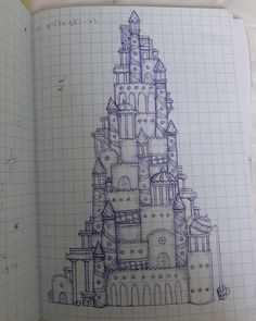 an open notebook with a drawing of a castle