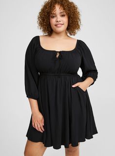 FIT Model is 5'10. 5” wearing size 1. Babydoll silhouette. . Measures 40” from shoulder (size 2). . MATERIALS + CARE Washable Gauze woven fabric: The lightweight, breathably soft fabric you love is, at last, wash, wear and go! . Stretch level: None. 75% rayon, 25% polyester. Machine wash cold. Tumble dry low. Imported. DETAILS V-neck. . Cinched under bust. 3/4 blouson sleeves. . Functional pockets. . The best plus size women's mini 3/4 sleeve tie front detail babydoll dress & empire waist dresses in deep black made of washgauze. Rock your look from Torrid to Festivals like Coachella and Lollapalooza, a concert, a show, or just for fun! Torrid is your destination for cozy fall and winter clothes to keep you warm and comfortable. These babydoll & empire waist dresses can be great for pregnan Black Babydoll Dress, Black Babydoll, Empire Waist Dress, Empire Dress, Dress Images, Peasant Dress, Flowy Dress, At Last, Babydoll Dress