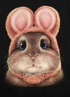 a close up of a mouse's face wearing a hat with ears on it