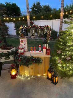 an outdoor bar with christmas decorations and lights