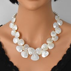 Elegant Pearl White Beaded Necklaces For Gift, Elegant Pearl White Beaded Necklace For Gift, Elegant Shell Necklace With Pearl Pendant, Elegant Pearl Drop Choker As Gift, Unique Pearl Necklaces For Party, Elegant Pearl Pendant Shell Necklace, Elegant Silver Pearl Shell Necklace, Elegant White Choker, Elegant Beaded Pearl Shell Necklace