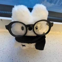 a stuffed animal with glasses on it's head