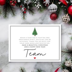 a christmas card with the words team on it and ornaments around it in red, white and green