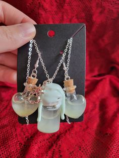 Add a touch of enchantment to your style with this charming Magic Shimmer Potion Bottle Necklace and Earring Set! This whimsical pendant features a miniature glass bottle filled with sparkling shimmer potion, capturing the essence of magic and mystery. The glass bottle is securely sealed and suspended from a dainty chain, perfect for adding a hint of mystical allure to any outfit. Whether you're a lover of fantasy or simply appreciate unique jewelry, this set is sure to bring a touch of magic to your day. Perfect for cosplay or ren faire accesories! ONE OF A KIND PIECE PLEASE NOTE I MAY NOT BE ABLE TO RECREATE THIS SPECIFIC COLOR! (If You Love it.. Get it now!) ;) Each necklace set is a handmade treasure and  truly ONE OF A KIND!  Chains (22.5" long) with easy to use clasps. 925 Sterling S Shimmer Potion, Color Changing Potion, Potion Necklace, Magical Potion, Jar Jewelry, Spell Jar, Bottle Necklace, Potion Bottle, Dainty Chain