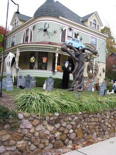 a house decorated for halloween with decorations on the front