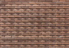 a brown brick wall with several different shapes and sizes