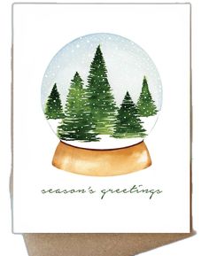 a snow globe with trees in it and the words season's greeting written inside