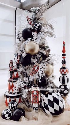 a christmas tree decorated with black and white ornaments