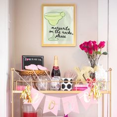 a happy hour sign is hanging above a bar cart filled with drinks and condiments