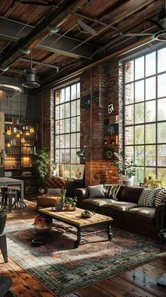 a living room filled with lots of furniture and large windows next to a brick wall