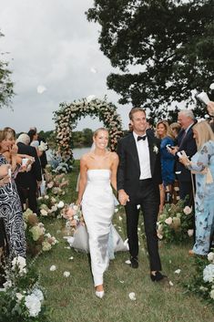 a newly married couple walking down the aisle