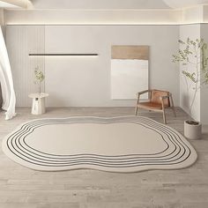 a white rug with black lines on the floor in a living room next to a chair and potted plant