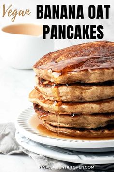 a stack of banana oat pancakes with syrup on top