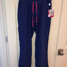 Adorable Women's Smitten Straight Leg Cargo Pants New With Tags Sz Psm 90% Poly And 10% Spandex In A Beautiful Purple With Bright Fuschia Pink Accents All Measurements Taken Across In Inches Waist: 15 Rise: 10 Inseam: 29 Leg Opening: 8.75 Questions? Please Message Me From A Clean, Smoke Free Home Sporty Purple Workout Pants, Purple Stretch Activewear With Pockets, Purple Workout Bottoms With Pockets, Purple Straight Leg Cargo Pants With Pockets, Purple Casual Activewear With Elastic Waistband, Purple Straight Leg Pants With Elastic Waistband, Casual Purple Activewear With Elastic Waistband, Purple Activewear With Pockets For Sports, Purple Stretch Pants For Sports