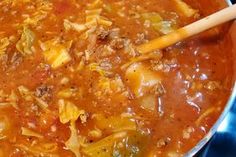 a large pot filled with soup on top of a stove