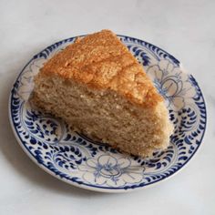 a piece of cake sitting on top of a blue and white plate