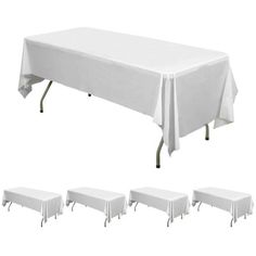 a table with six chairs and a white tablecloth on it, all in different positions