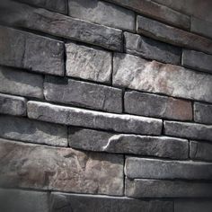 a stone wall made out of different types of rocks