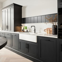 This Arbor kitchen has been handpainted in a striking black shade, blending modern elegance with classic charm. The sink provides the perfect monochrome backdrop for a striking kitchen #harveyjoneskitchens #kitchendesign #kitcheninspo #kitchensofinstagram #kitchens #kitcheninspiration #monochrome #monochromekitchen #monochromestyling #kitchen #uk #darkkitchens #dramatickitchens Monochrome Kitchen, Dark Kitchen, Modern Elegance