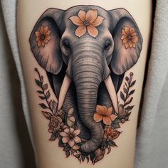 an elephant with flowers on it's thigh