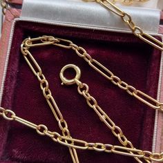 A beautiful and versatile long antique chain crafted in 15ct yellow gold, comprised of three oval links then an elongated link, fastened with a bolt ring clasp. The length of this chain makes it great for layering with other necklaces! Circa 1910-1920. Stamped "15C" for 15ct gold. The chain measures approximately 800mm (L) x 3.4mm (W). The approximate weight is 20.0 grams. Please note that the antique box pictured is for display purpose only. Thank you. CONDITION: In very good antique condition, Vintage Jewelry With Oval Link Cable Chain, Classic Gold Chain Necklace With Hooks And Links, Classic Oval Link Rolo Chain Necklace, Classic Rolo Chain Necklace With Oval Link, Classic Chain Necklace With Rectangular Rolo Links, Classic Oval Link Chain Necklace With Hook And Links, 14k Gold Oval Figaro Chain Necklace, Yellow Gold Oval Link Chain Necklace With Hooks, Classic Oval Rolo Chain Necklace