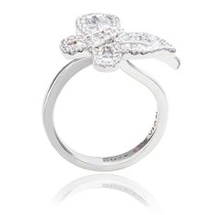 With elegance and subtlety, this Suzy Levian butterfly collection creation has become an icon of class, luxury and style. Let your creative side shine through with this whimsical double butterfly ring featuring white round and baguette shape cubic zirconia, hand set in sterling silver. This ring is designed by Suzy Levian with a message. By creating jewelry that is beautiful inside and out, Suzy Levian 's message is revealed through a hidden stone set inside the shank of this ring to empower wom Sl Logo, Double Butterfly, Butterfly Collection, Butterfly Ring, Beautiful Inside And Out, Creating Jewelry, Stone Settings, Women Empowerment, Baguette