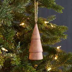 a wooden ornament hanging from a christmas tree