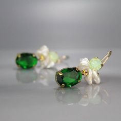 Green Swarovski Earrings, Bohemian Gemstone Earrings, Boho Earrings, Statement Jewelry, Green Earrings, Gold Filled Earrings, Boho ChicUnique and glamorous flamenco earrings features a gorgeous setting of green Swarovski set in copper bezel. With a touch of boho chic, these earrings have a lovely keshi pearl cluster and a green zircon drop. The perfect accent to all your favorite outfits, these earrings are an elegant statement piece. The hook is 14K gold filled.Perfect for a bride or bridesmaid Elegant Handmade Green Crystal Earrings, Green Crystal Gemstone Earrings, Green Crystal Earrings With Gemstone, May Birthstone Crystal Drop Earrings, Earrings Boho Chic, Angel Earrings, Peridot Jewelry, Pearl Cluster, Green Jewelry