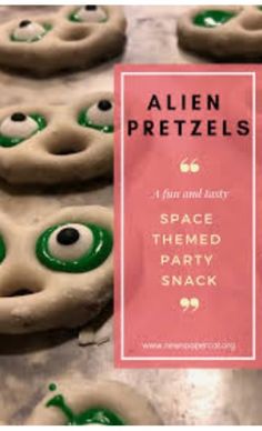 alien pretzels with green eyes and googly eyes on them, are ready to be eaten